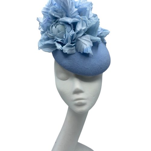 Stunning baby blue felt base headpiece with colour matching stunning handmade silk flowers.
